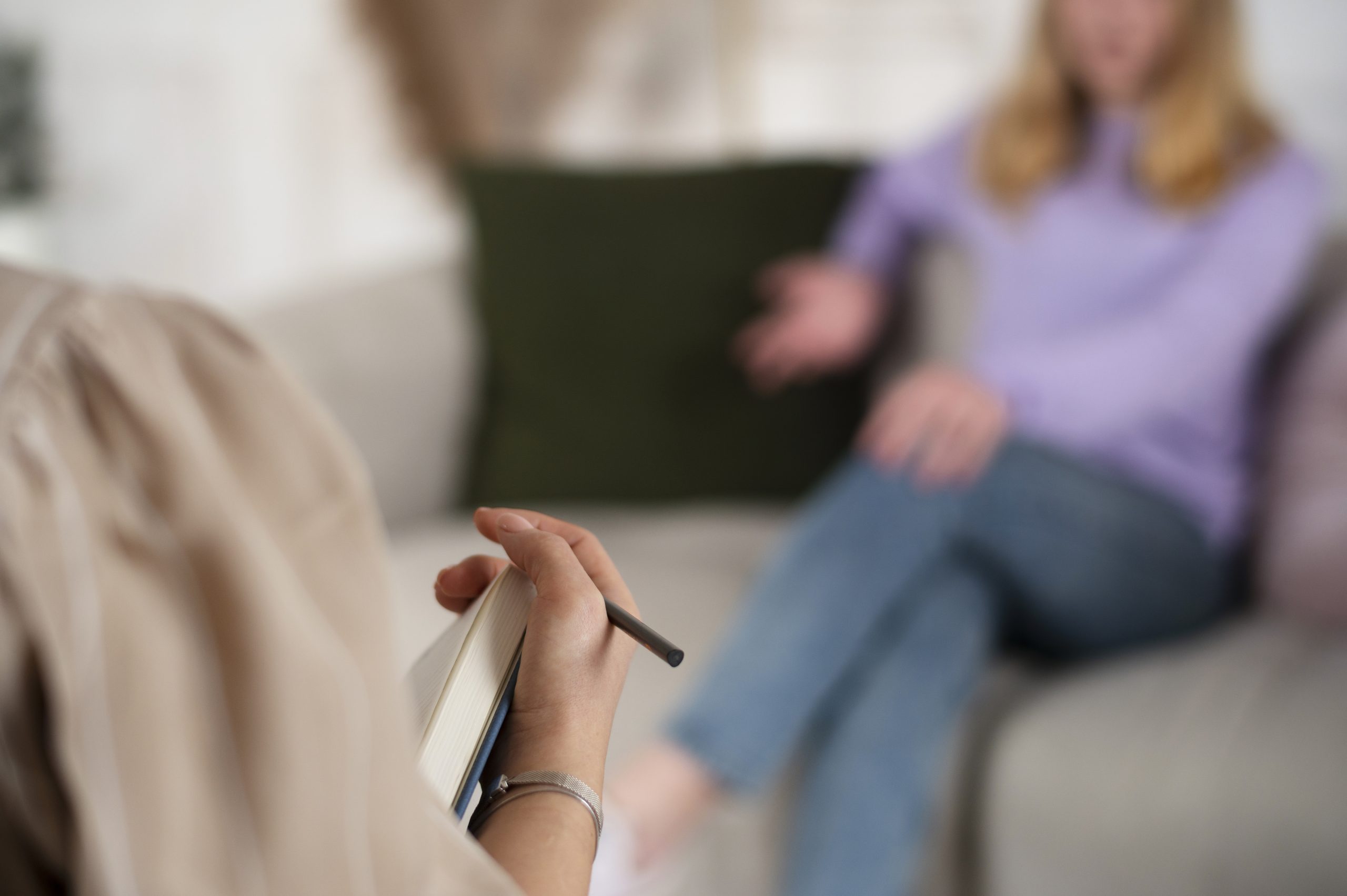 sided view young girl talking therapist